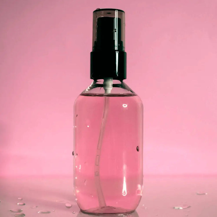 MIANIMED premium skincare spray bottle against a pink background